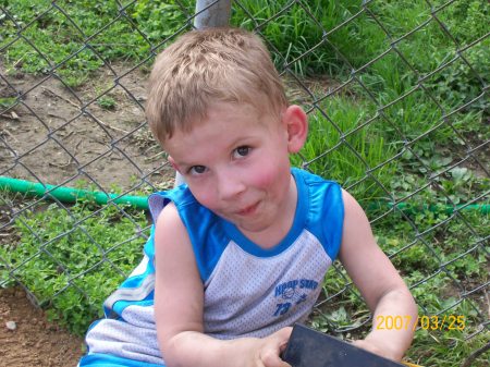 Zackary playing in the dirt in the backyard-- isnt he cute?