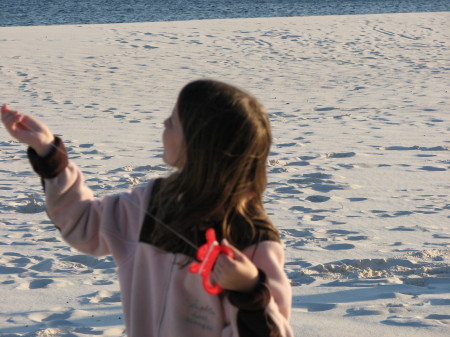 my grand daughter Ashlie flying a kite