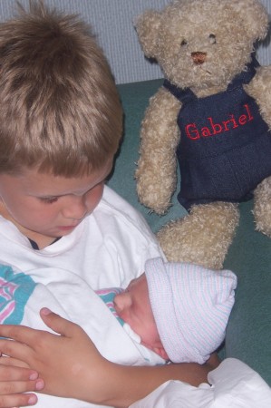 Big Brother Nathaniel holds Gabriel