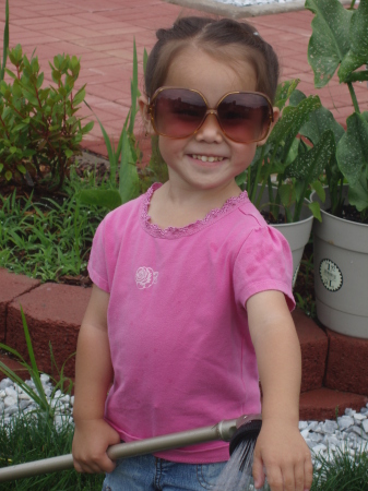 Daughter gardening with her cool shades on