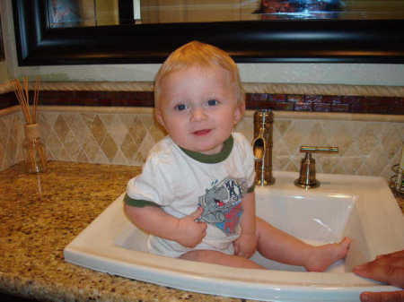 Adam in the bathroom sink