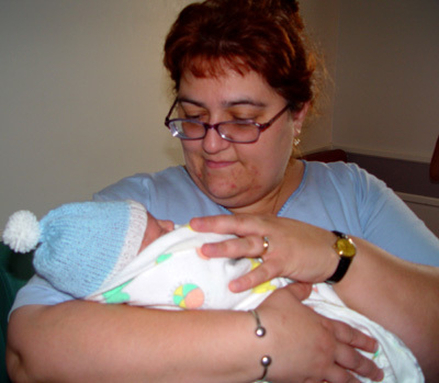 Holding my newborn nephew, Aidan (July 2004)