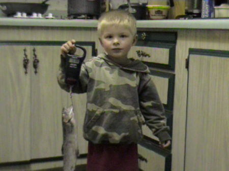 MY YOUNGEST SON DEXTER HOLDING HIS CATCH