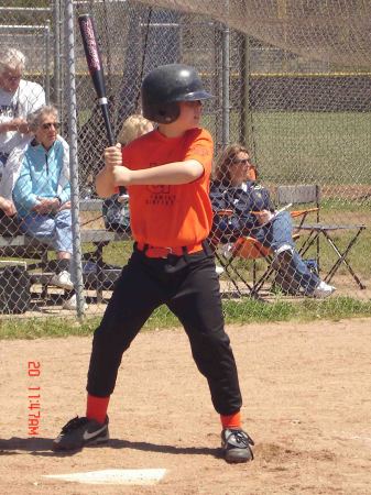 Grandson Austin batting at a Little League game