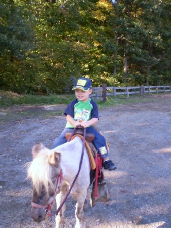 His first horse ride.