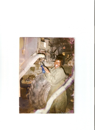 Me working on my truck in the Army 1999