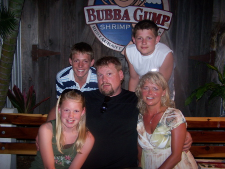 our family picture in front of Bubba Gumps in Maui
