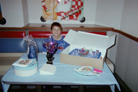 My son with his Birthday Cake at Chucky Cheese