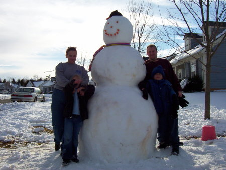 family after building snowman