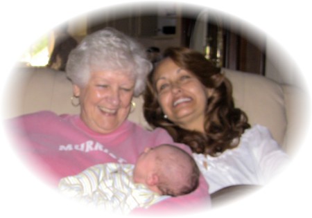 my mom and me with brand new grandbaby