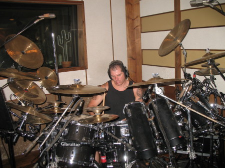 Recording the new album. Yes I still play drums in a band