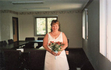 Debbie before the wedding holding her bouquet