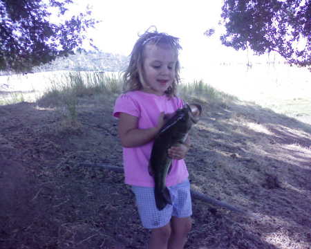 Nickole and her fish that she caught in our pond