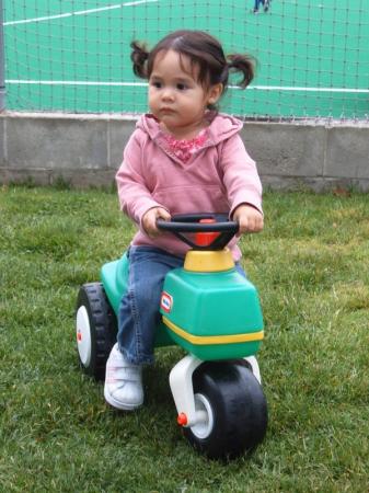 sweetpea & her beloved tractor. may.07