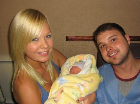 Newborn Hayden with Auntie Camille and Dad