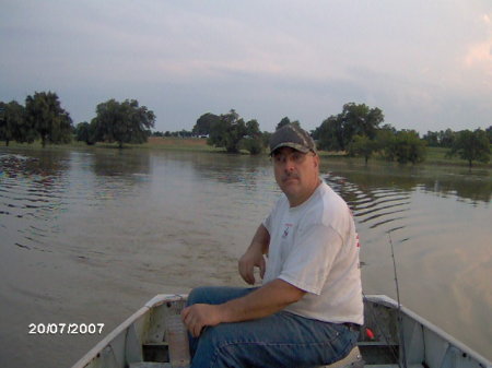 Rob boating in our flooded pasture