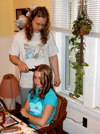Josh helping Ali with her hair