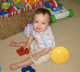 Joseph, 12 months, smiling for mom