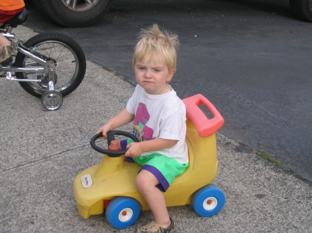 Devon 2 yrs old riding bikes with brother