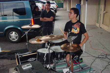 Sons Khalid and Frederick, who is drumming.