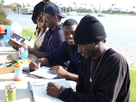 Isaha infront, Malik next to him drawing