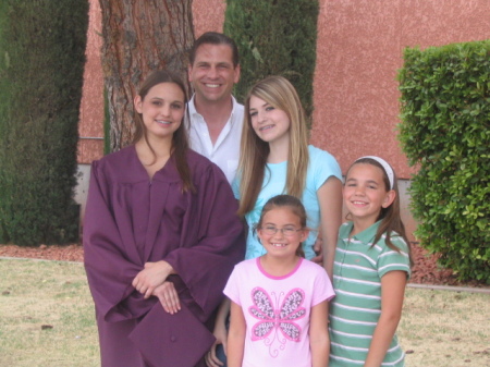 My husband Dave with his 4 daughters at the oldests graduation- May 07
