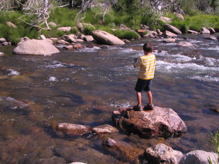 My son catching his first fish