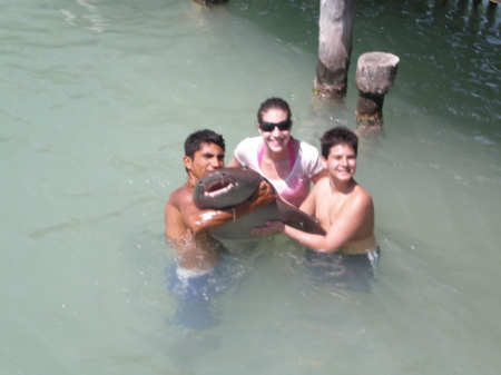 Kathleen and Josh holding a shark