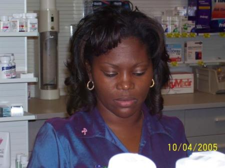 Jo at work in the Pharmacy counting pills