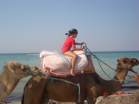 My daughter Angela riding a camel in Tunisia.