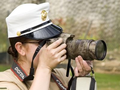 Kelly at work as a Marine photographer/videographer