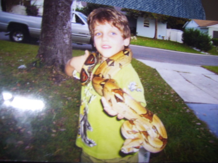 c.j with his red tail boa