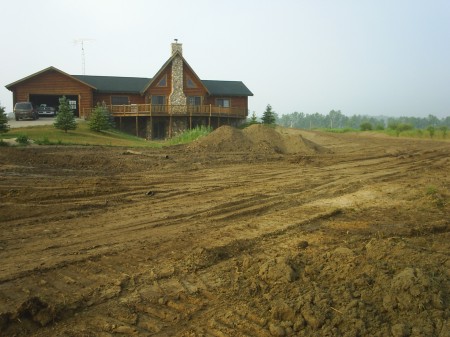My house (we were diging the pond bigger that is why there is so much dirt)