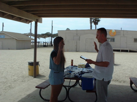 CARLA AND LT. ROUNDY REENLISTING AT BEACH