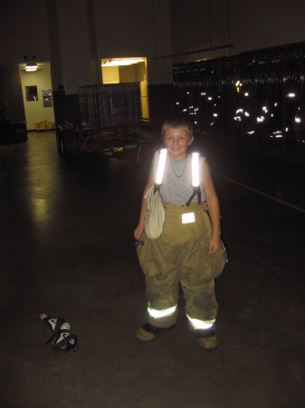 Nicholas-( our youngest son) in his Dad's Firefighter pants