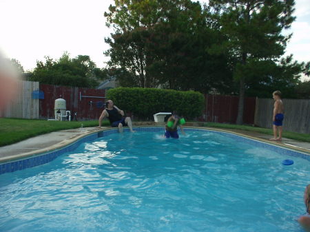 My daughters husband and kids in the back yard pool.