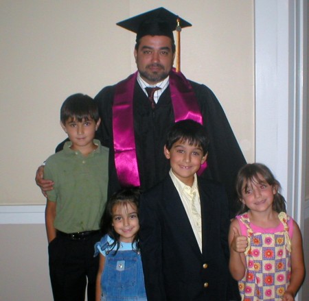 MIchael and kiddos at graduation ceremony