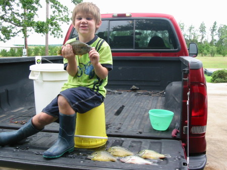 Blayne's proud catch of the day.