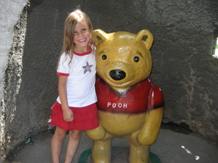 Olivia, our fashion diva, and Pooh Bear at Storybook Island