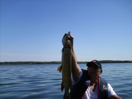 my husband arnold at the lake fishing
