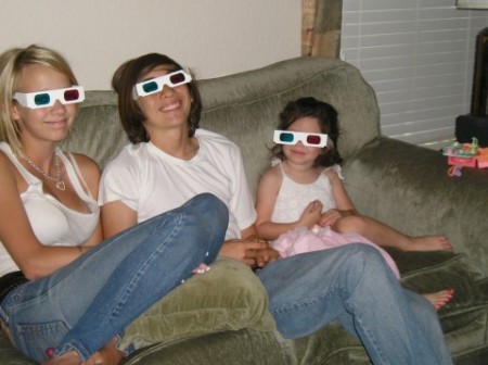 Taylor and her boyfriend, with Olivia watching "Shrek 3D"