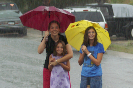 Wife and kids playing in the rain