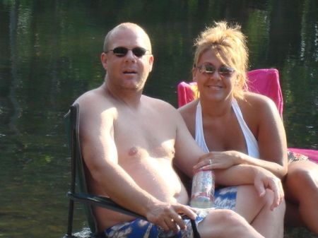 My husband Mike and I in the river by our house.