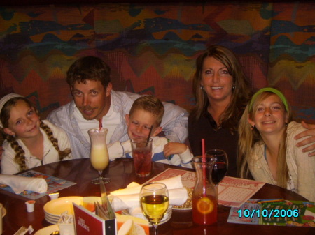 Our family out to dinner...Chandler has his crazy face on :)