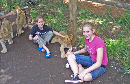 girls with lion cub, south africa (Dec 2006)