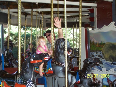Grandpa and Kylie on carousel