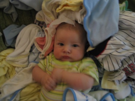 Logan in a pile of laundry!