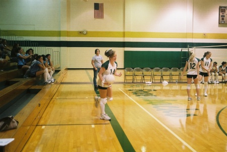 Molly getting ready to serve at a recent volleyball match