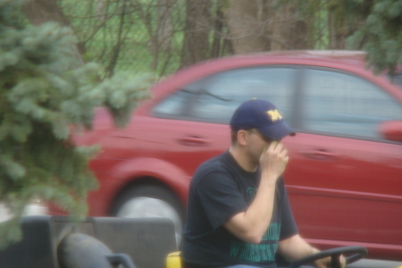 Dan mowing the front lawn 2010