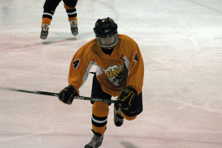 Greg playing Hockey.